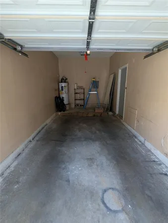 a view of a garage with wooden floors
