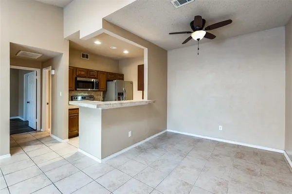 a view of a kitchen with a sink and a microwave