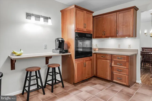 a kitchen with stainless steel appliances granite countertop a sink counter space and cabinets