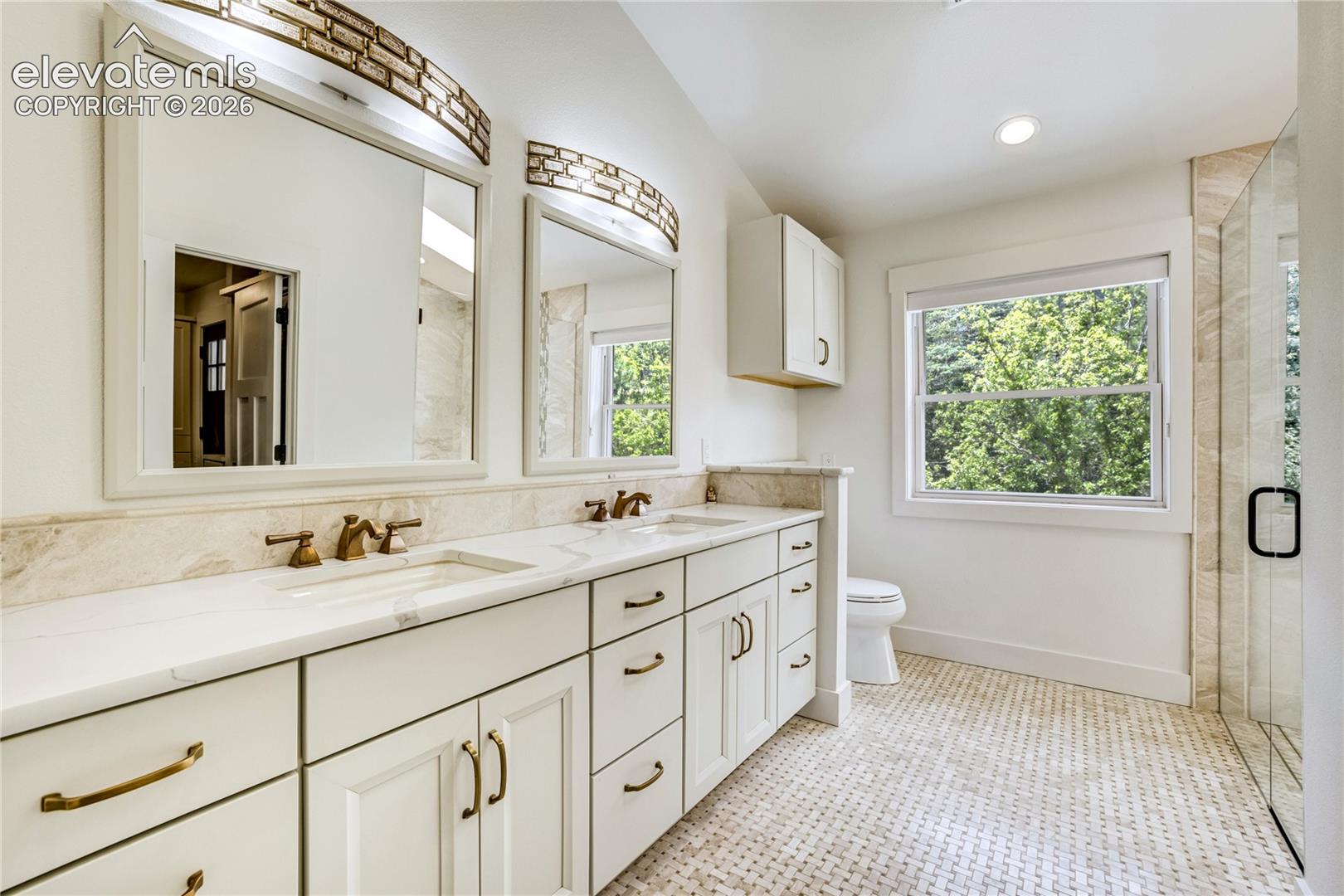 3 Thayer Road Colorado Springs, CO 80906 - Photo 30 of 50 Spa-inspired luxury featuring heated floors, designer finishes, and a spacious walk-in shower.