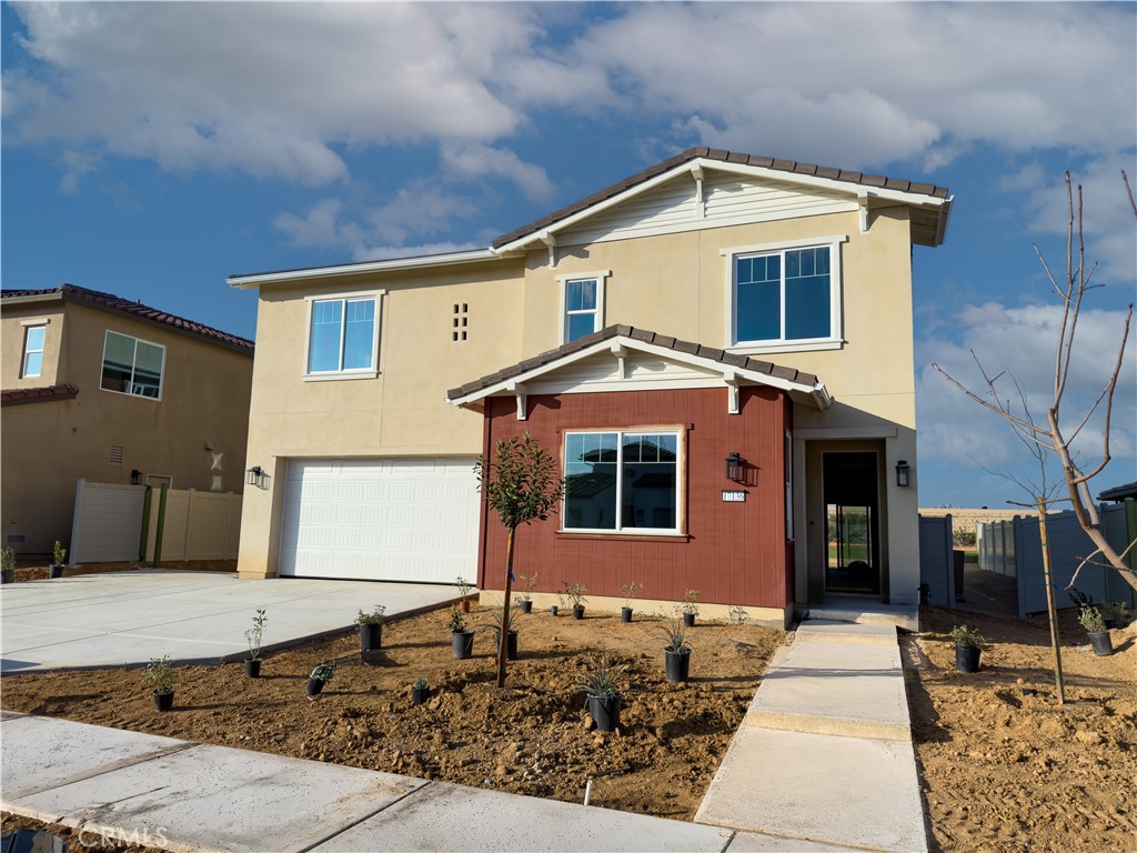 17136 Kent Street Hesperia, CA 92345 - Photo 2 of 4 a front view of a house with a yard