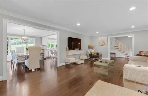 a living room with fireplace furniture and a flat screen tv