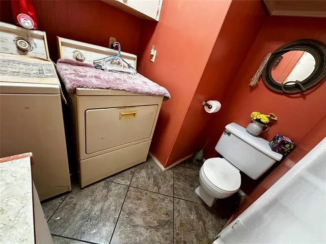a stove top oven sitting inside of a kitchen