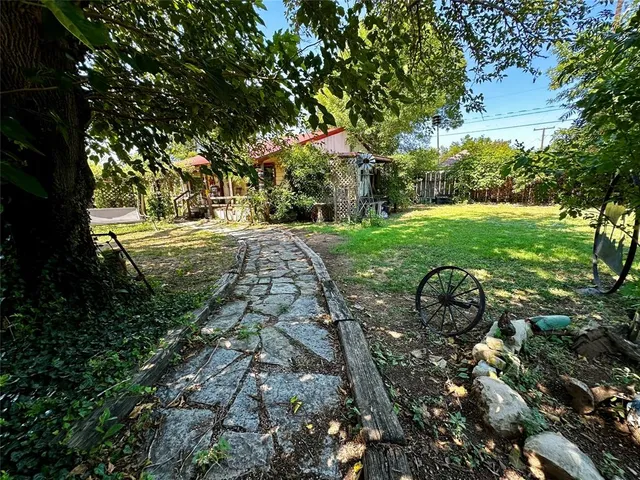 a backyard of a house with lots of green space