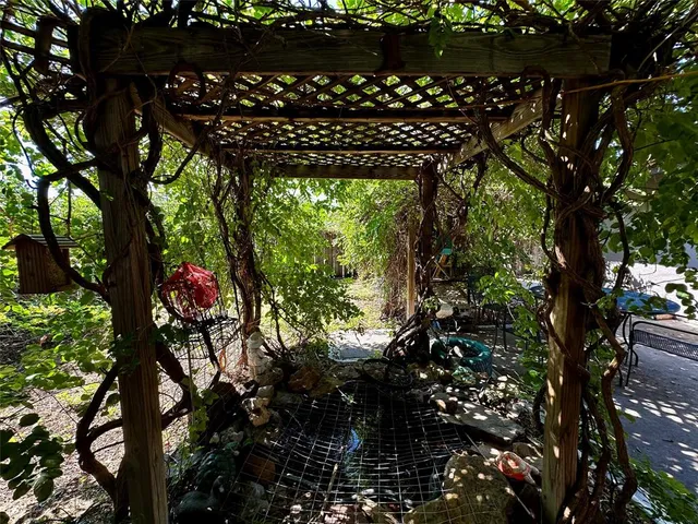 a view of a house with balcony and garden