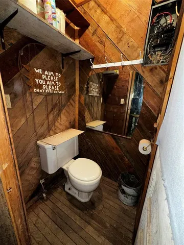 a backyard of a house with lots of green space and fountain