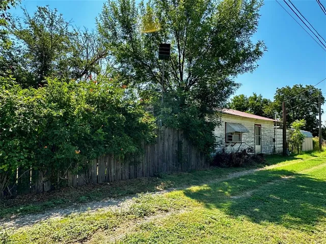 a backyard of a house with lots of green space