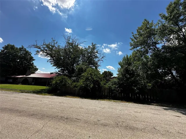 a view of a car in front of a house