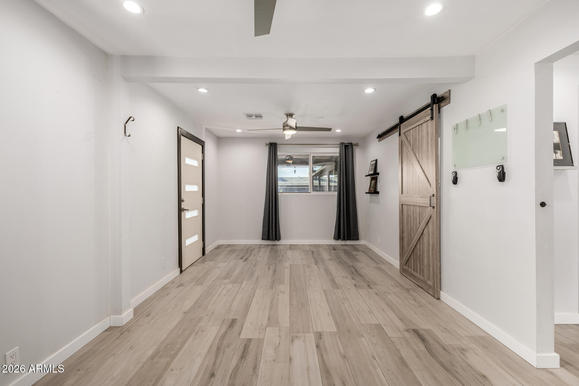 2402 North 37th Street Phoenix, AZ 85008 - Photo 24 of 44 a view of livingroom with hardwood floor and window