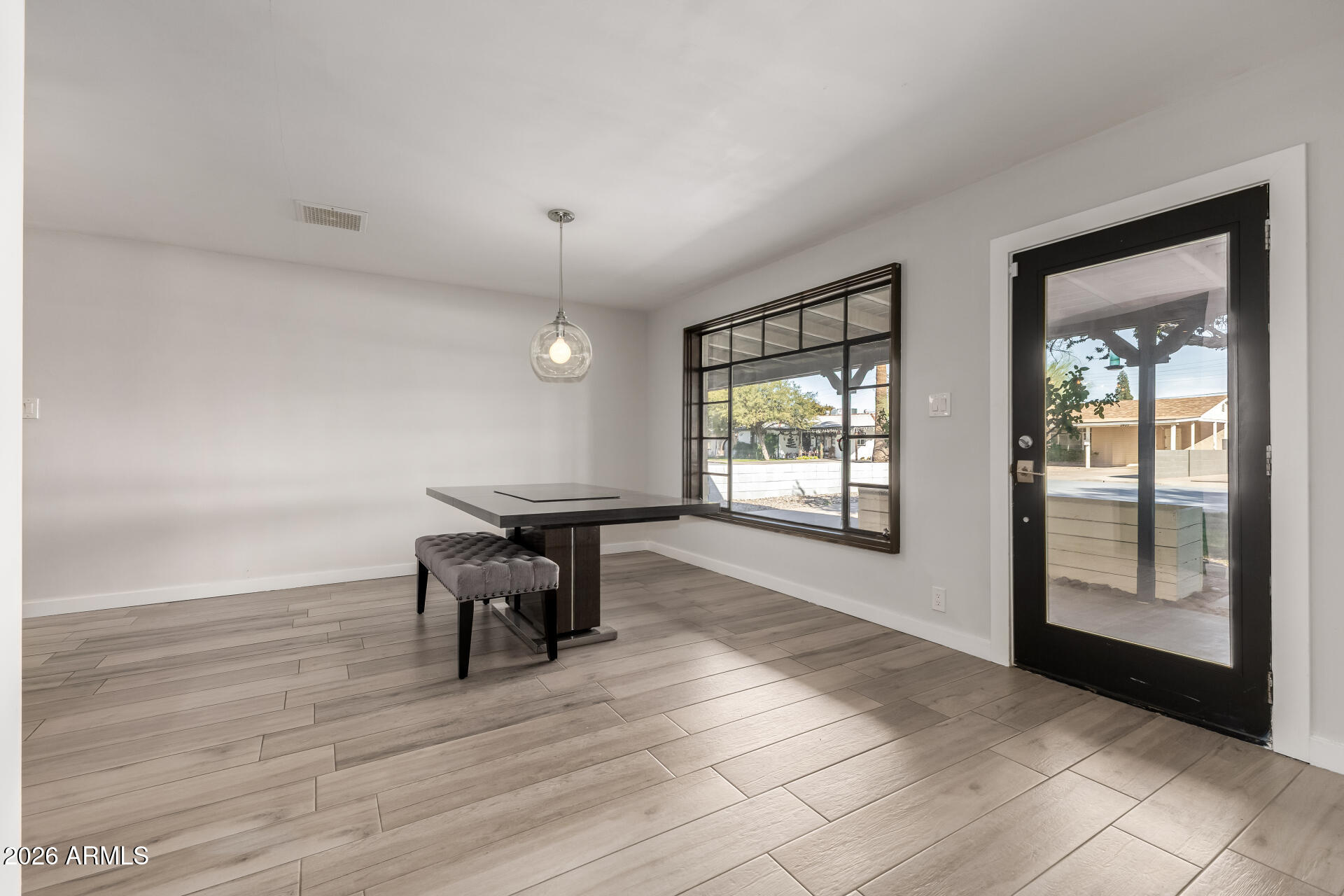 2402 North 37th Street Phoenix, AZ 85008 - Photo 3 of 44 a living room with furniture and a window