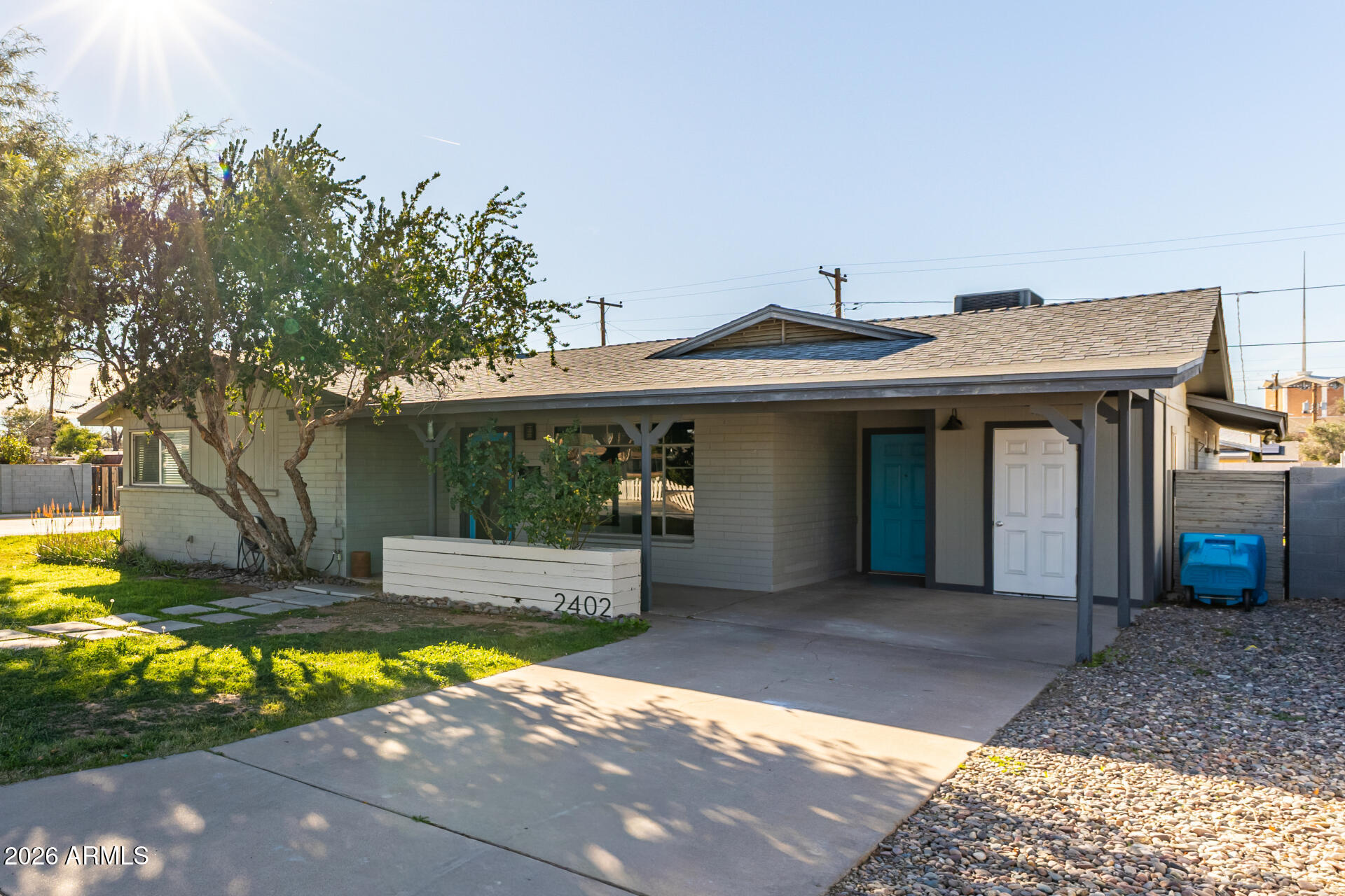 2402 North 37th Street Phoenix, AZ 85008 - Photo 40 of 44 a front view of a house with a yard