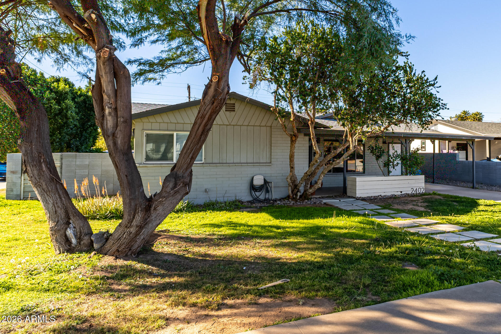 2402 North 37th Street Phoenix, AZ 85008 - Photo 42 of 44 a view of a house with swimming pool and sitting area