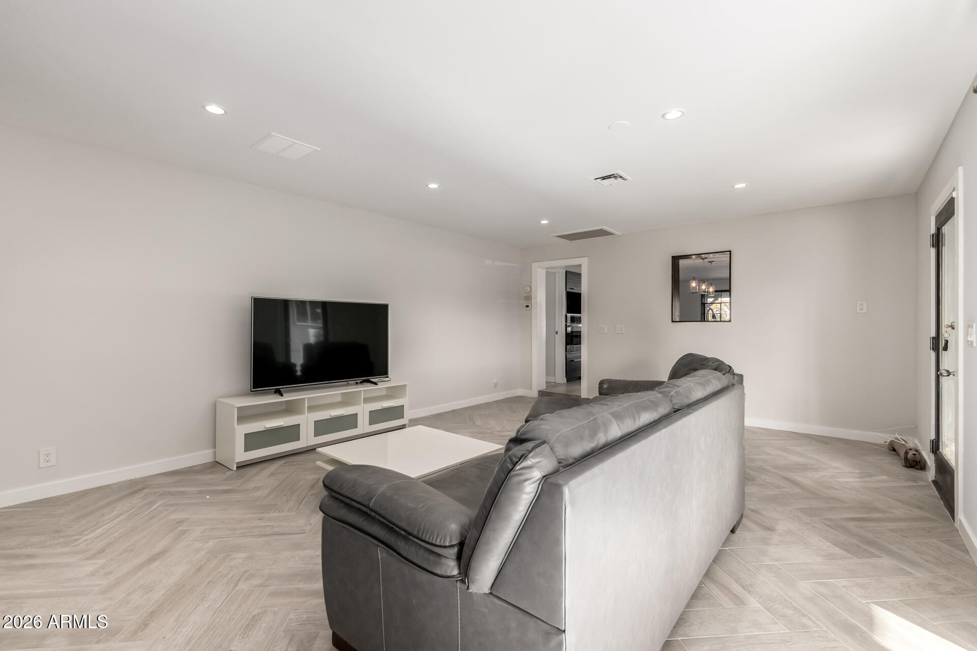 2402 North 37th Street Phoenix, AZ 85008 - Photo 7 of 44 a living room with furniture and a flat screen tv