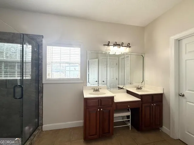 a room with a sink and a mirror