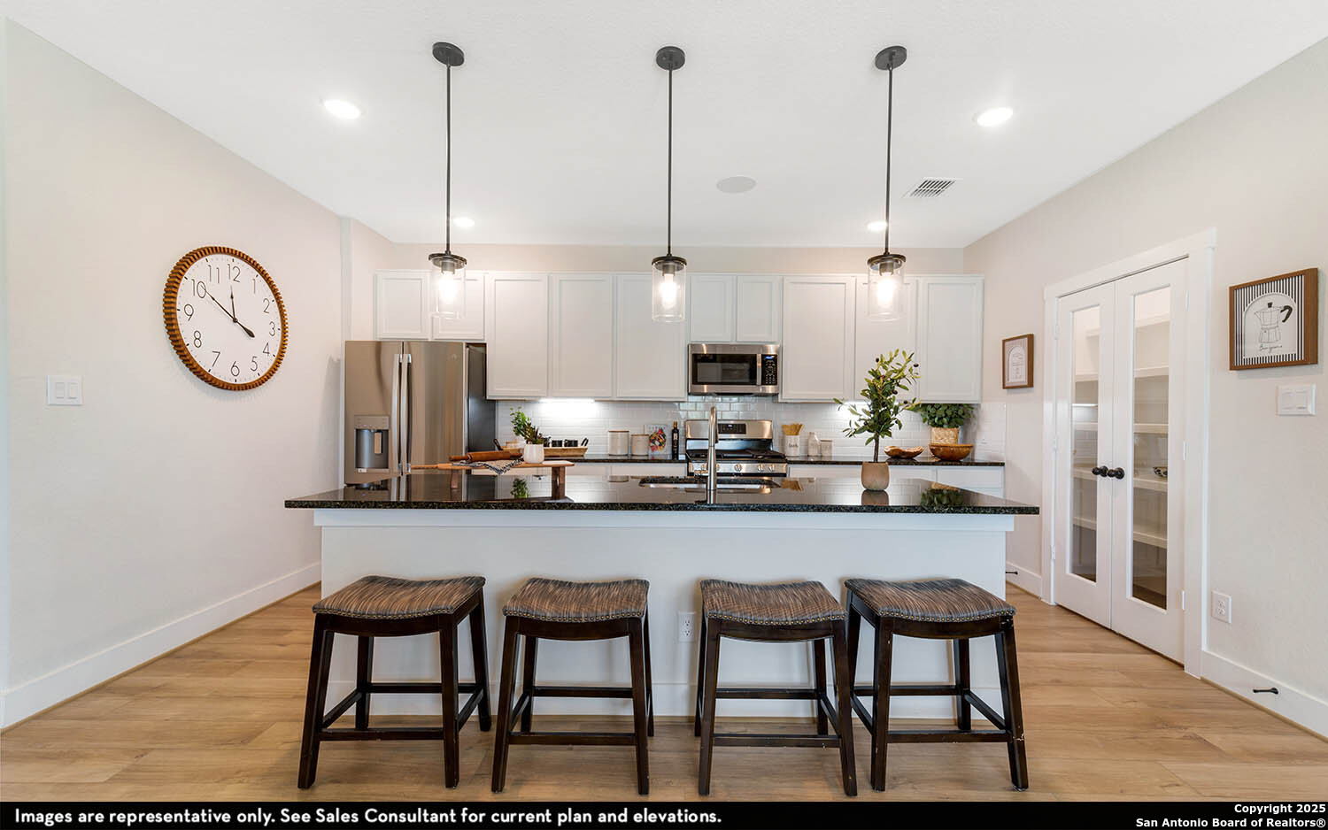 408 Jills Path Seguin, TX 78155 - Photo 11 of 25 a kitchen with stainless steel appliances granite countertop a kitchen island a stove a table and chairs