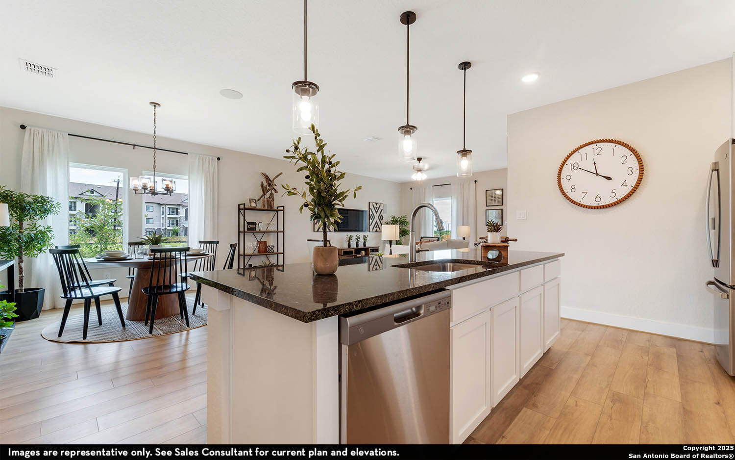 408 Jills Path Seguin, TX 78155 - Photo 14 of 25 a kitchen with stainless steel appliances granite countertop a kitchen island a stove and a view of living room