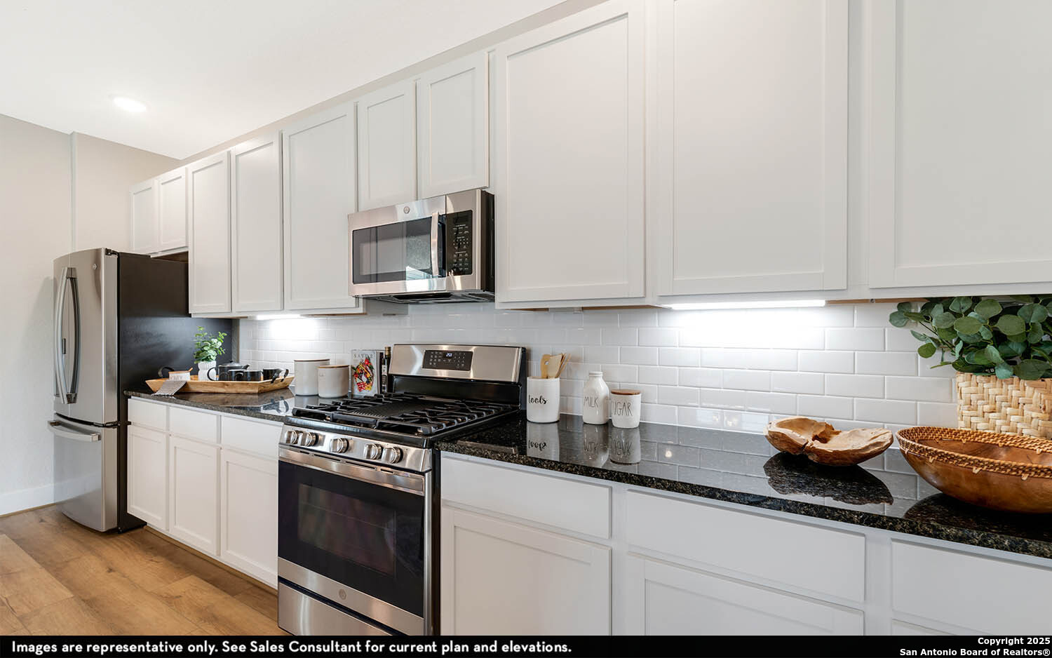 408 Jills Path Seguin, TX 78155 - Photo 15 of 25 a kitchen with stainless steel appliances granite countertop a sink stove and refrigerator