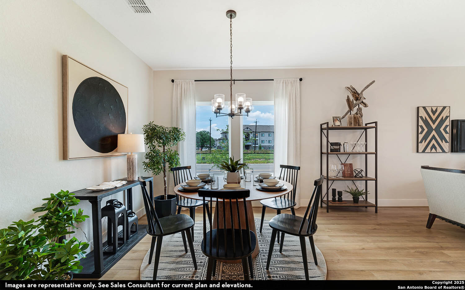 408 Jills Path Seguin, TX 78155 - Photo 10 of 25 a dining room with furniture a chandelier and wooden floor