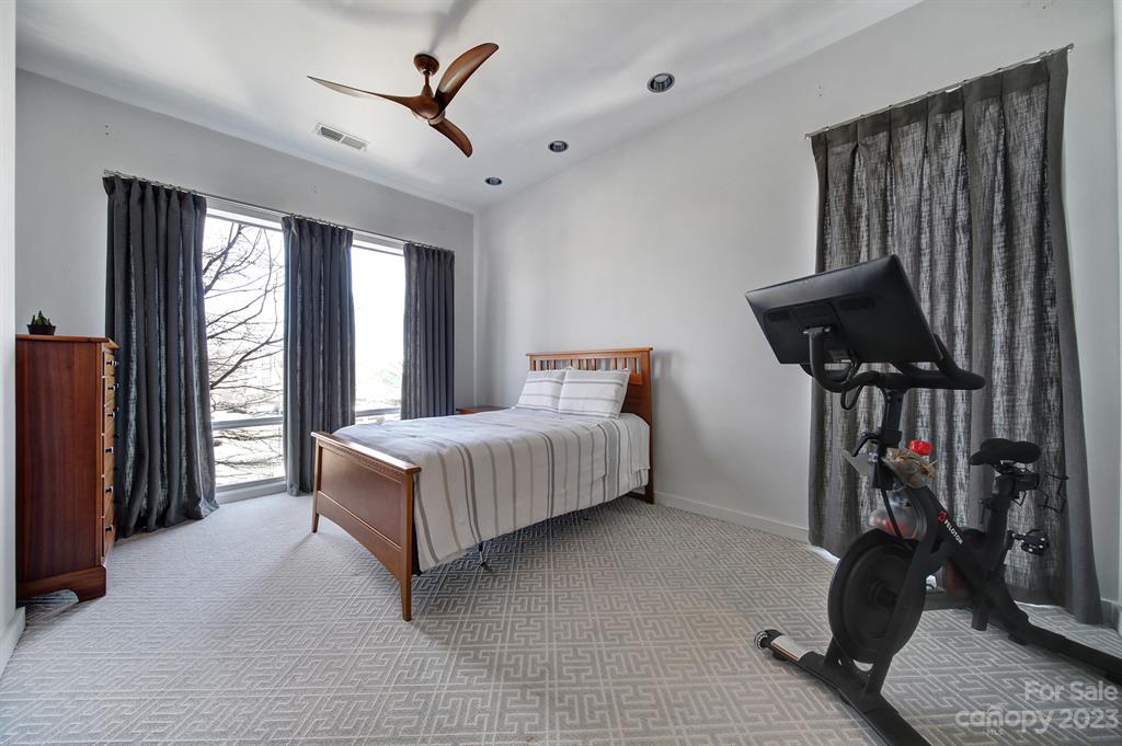 2116 McClintock Road, Unit 122 Charlotte, NC 28205 - Photo 13 of 27 a bedroom with bed and a large window