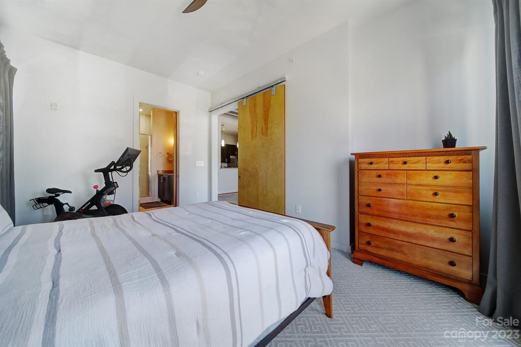 2116 McClintock Road, Unit 122 Charlotte, NC 28205 - Photo 15 of 27 a bedroom with a bed and a dresser
