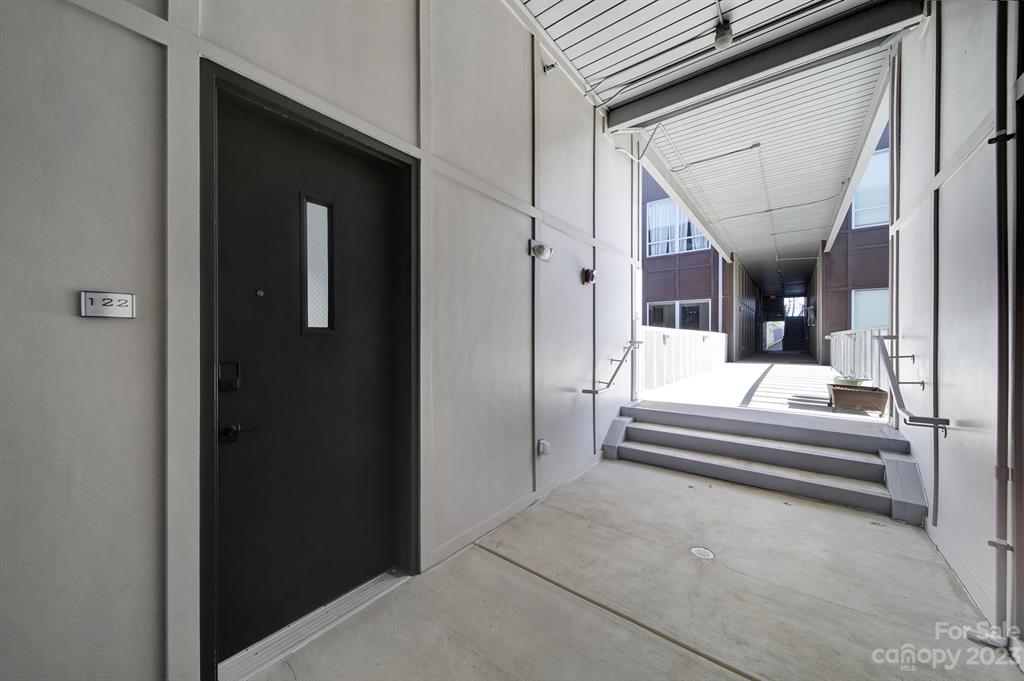2116 McClintock Road, Unit 122 Charlotte, NC 28205 - Photo 20 of 27 a view of hall way with mirror