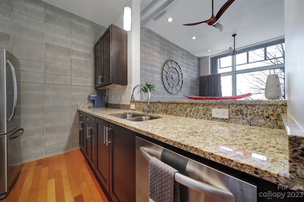 2116 McClintock Road, Unit 122 Charlotte, NC 28205 - Photo 5 of 27 a kitchen with a stove and a sink