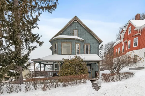a front view of a house with yard