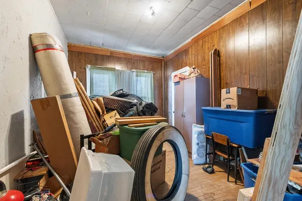 a view of a room with furniture and windows
