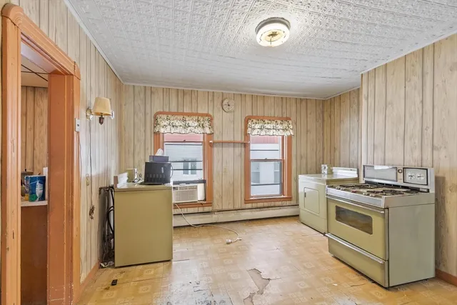 a kitchen with a stove and a cabinet