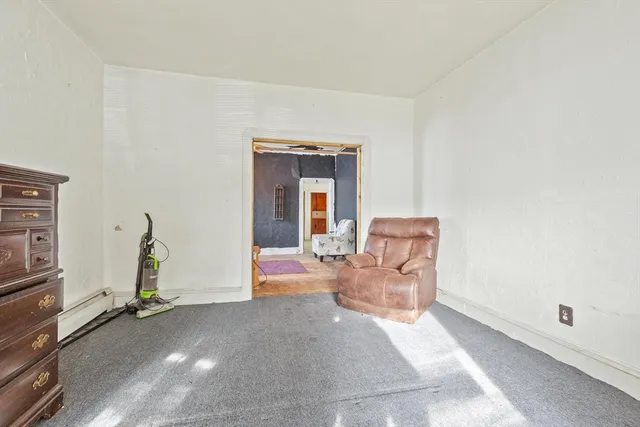 a living room with furniture a desk and chair