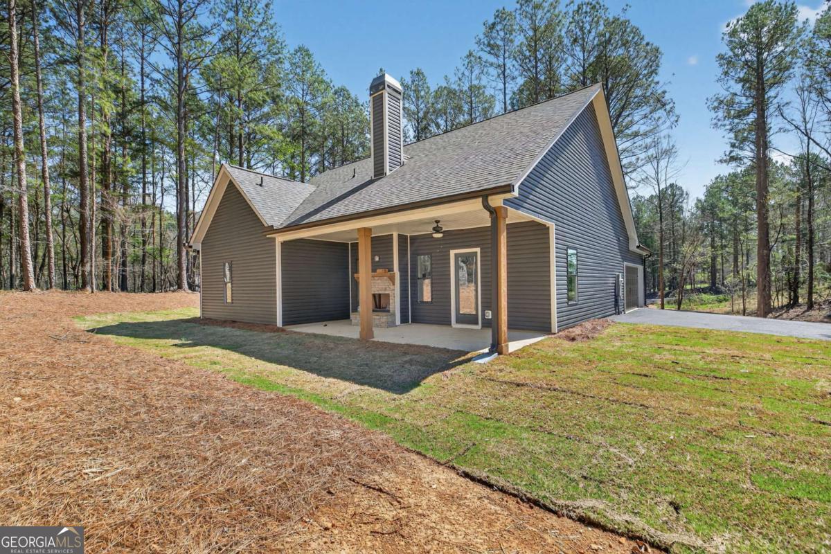 338 Dunn Road Cedartown, GA 30125 - Photo 35 of 44 a view of a house with a yard and large tree