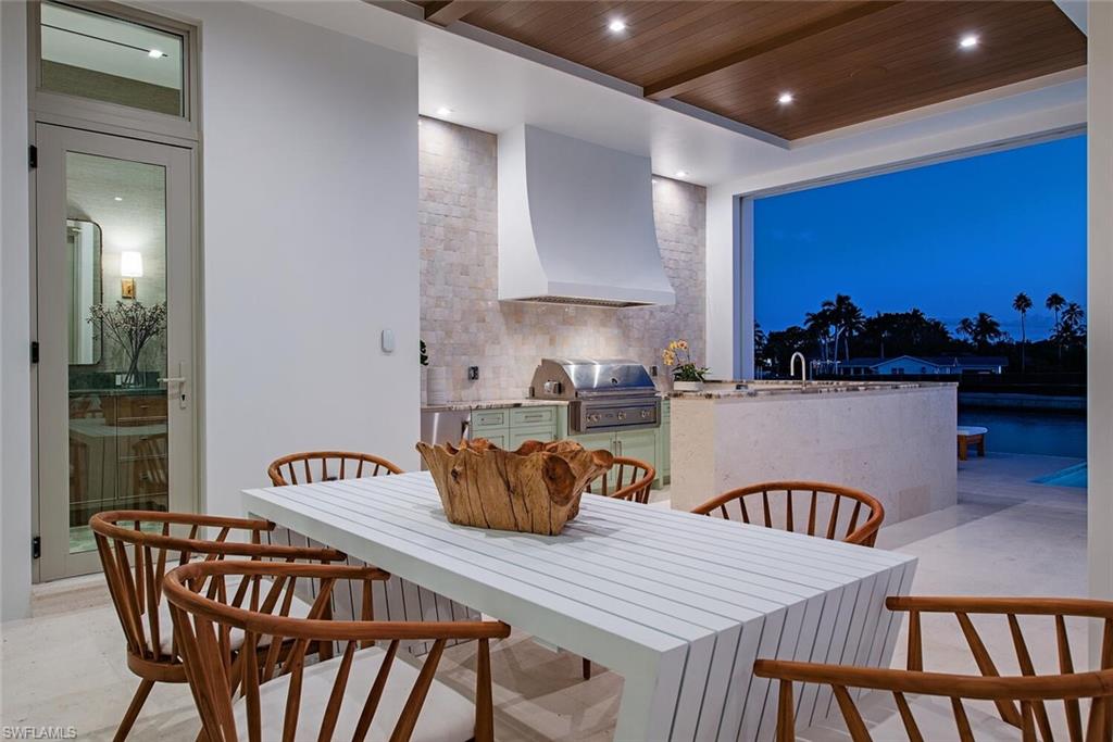 306 Springline Drive Naples, FL 34102 - Photo 5 of 50 Outdoor Dining and Kitchen