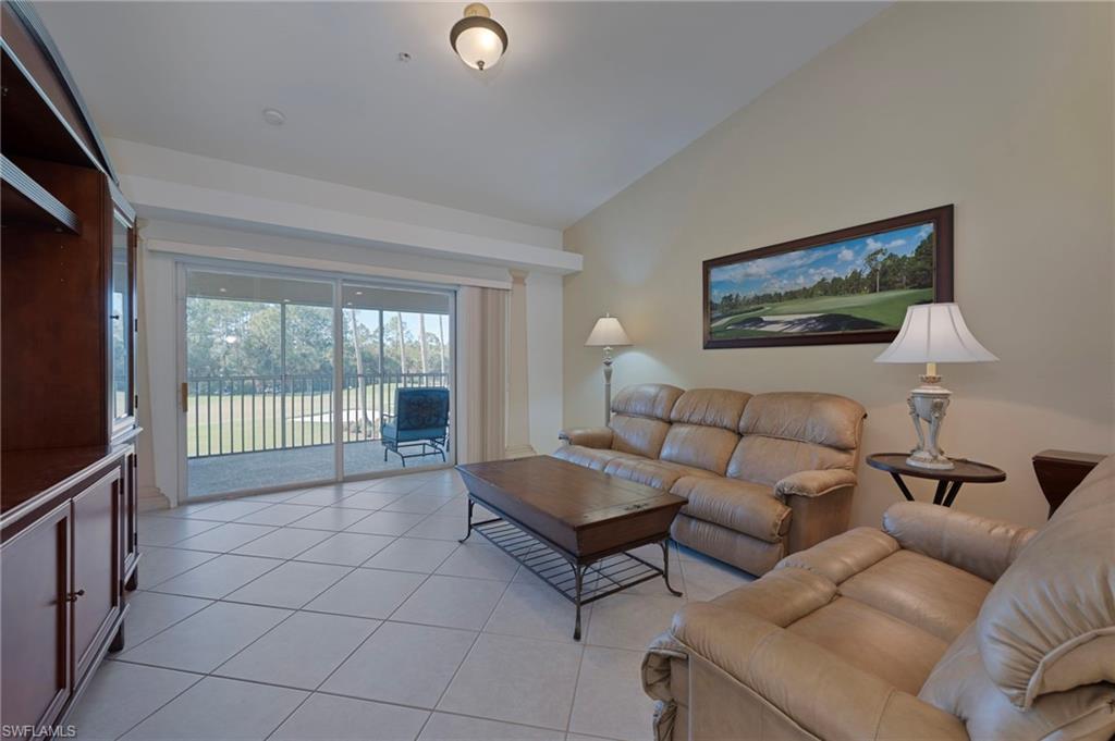3890 Sawgrass Way, Unit 2324 Naples, FL 34112 - Photo 7 of 18 Living Room with Vaulted Ceiling, to Lanai