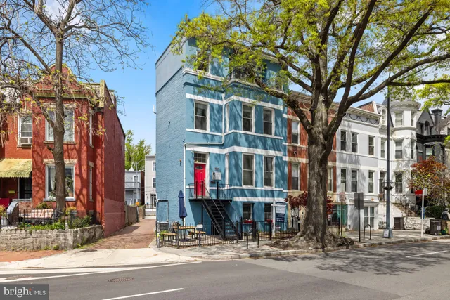 a view of a building with a street