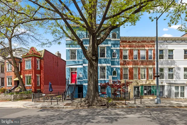 a front view of a building with street view