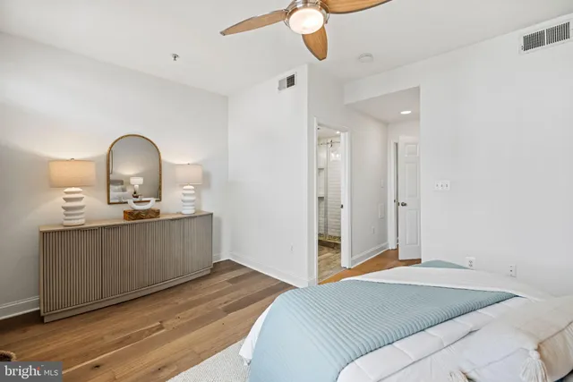 a bedroom with a bed and a dresser