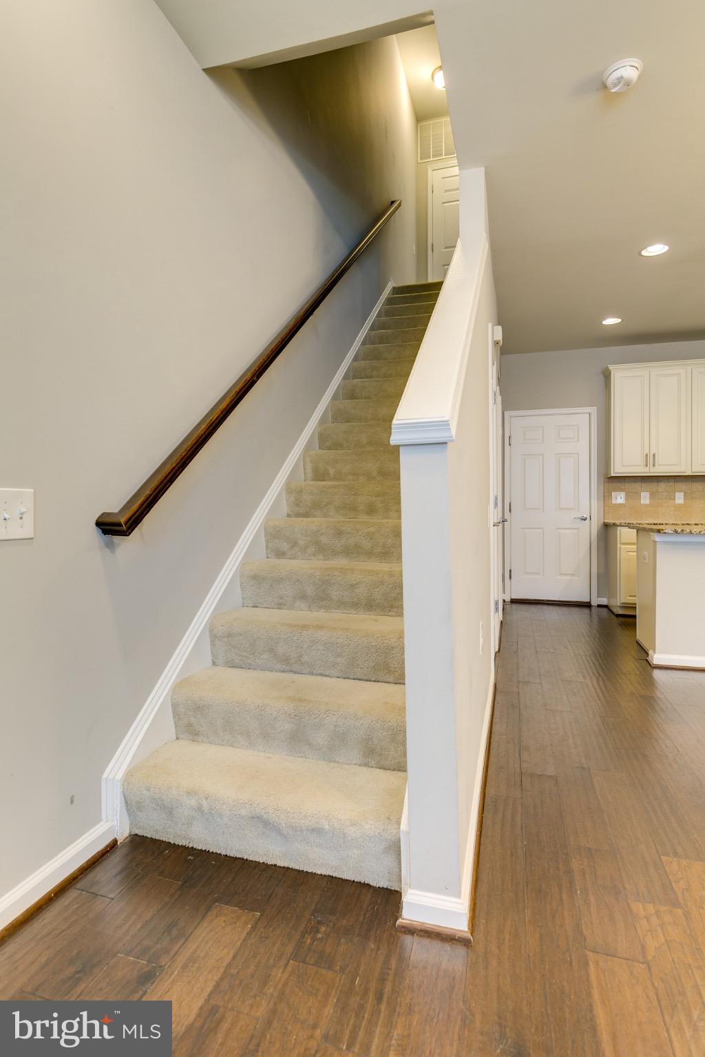 20581 Geddes Terrace Ashburn, VA 20147 - Photo 17 of 37 a view of entryway and kitchen with wooden floor