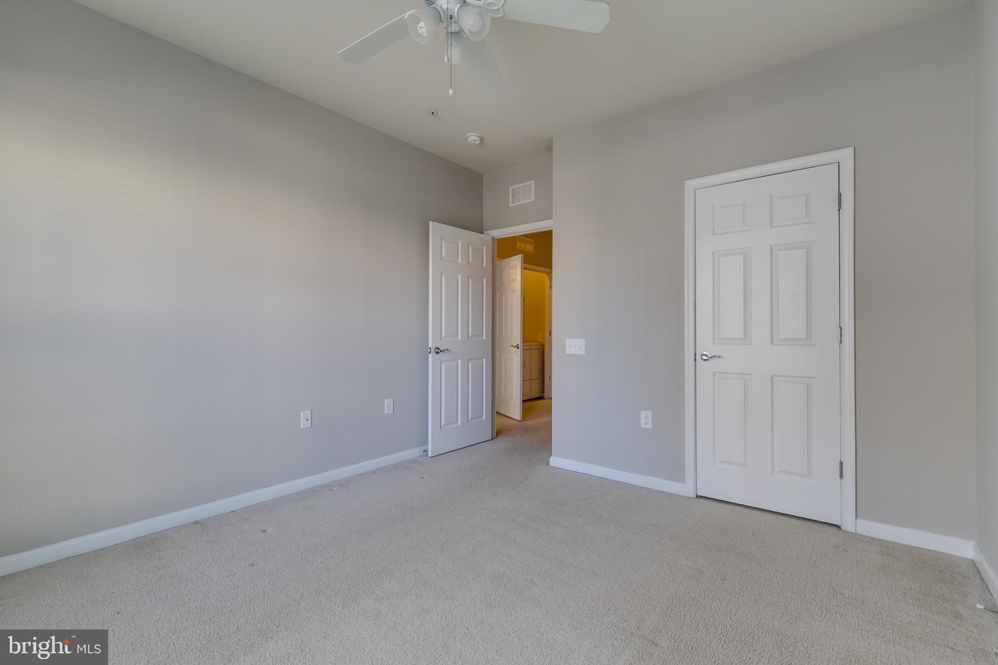 20581 Geddes Terrace Ashburn, VA 20147 - Photo 28 of 37 an empty room with closet and a chandelier fan