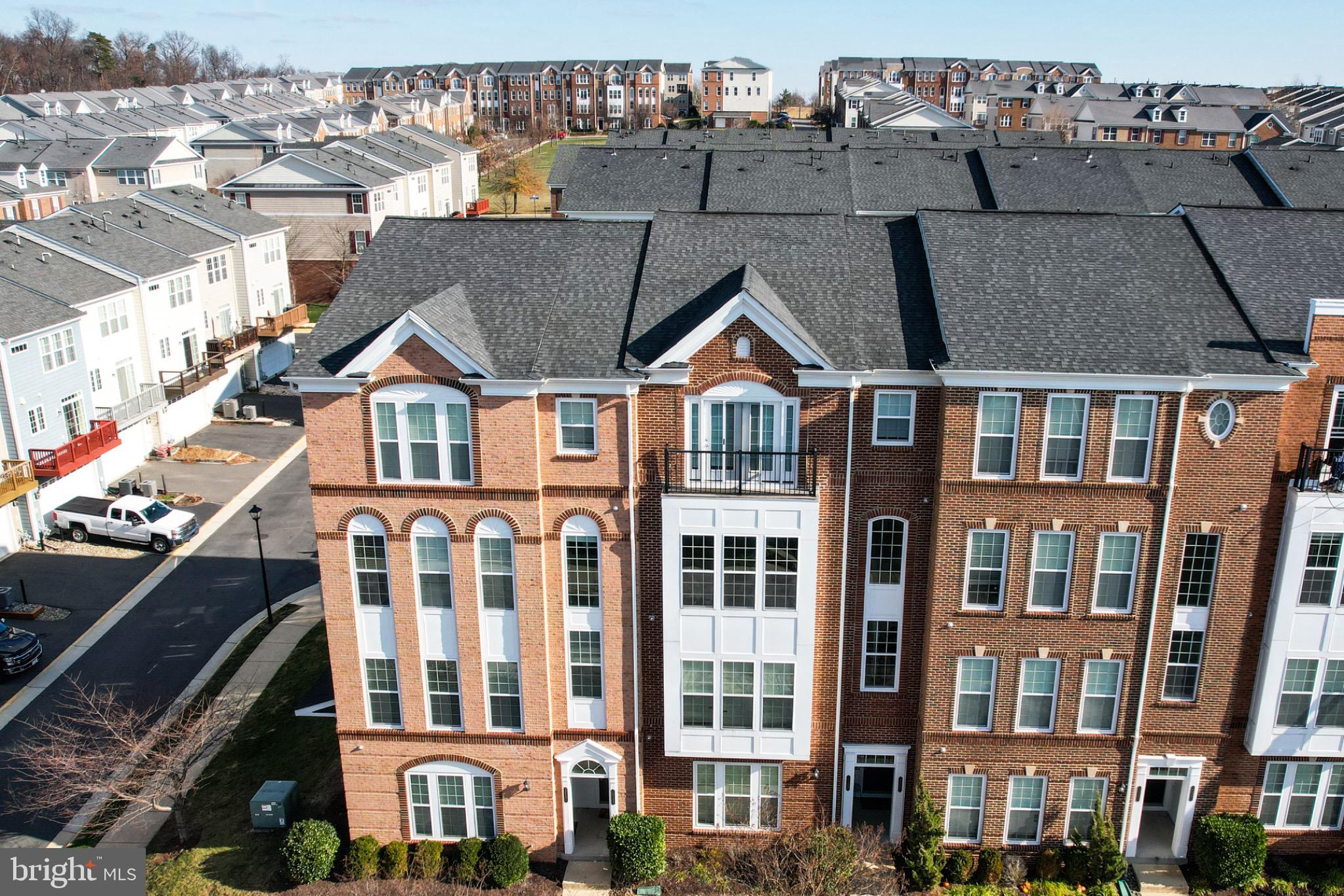 20581 Geddes Terrace Ashburn, VA 20147 - Photo 36 of 37 a front view of a residential apartment building with a yard