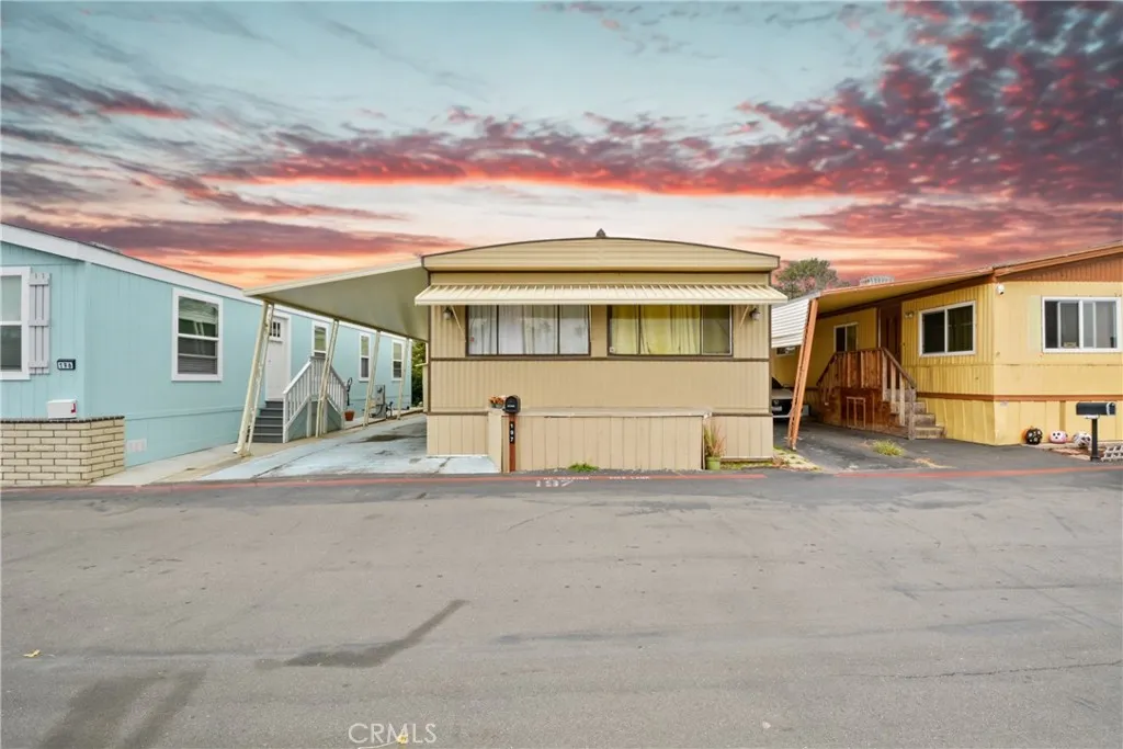 23701 South Western Avenue, Unit 197 Torrance, CA 90501 - Photo 1 of 32 a front view of a house with a garage