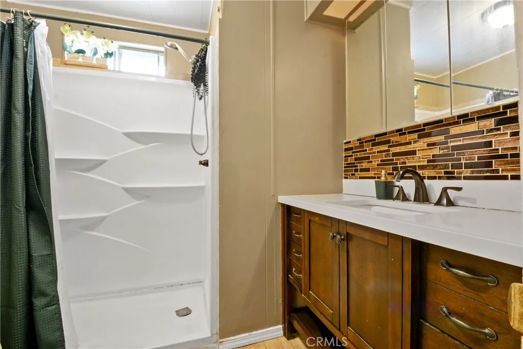 23701 South Western Avenue, Unit 197 Torrance, CA 90501 - Photo 16 of 32 a bathroom with a sink and a mirror