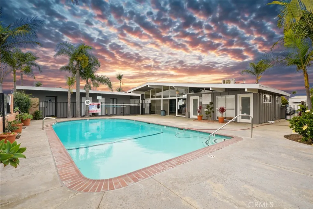 23701 South Western Avenue, Unit 197 Torrance, CA 90501 - Photo 2 of 32 front view of a house with a swimming pool