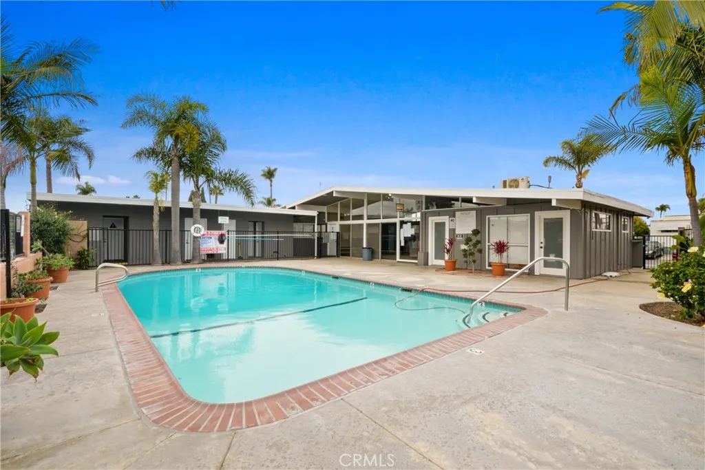 23701 South Western Avenue, Unit 197 Torrance, CA 90501 - Photo 24 of 32 front view of a house with a swimming pool