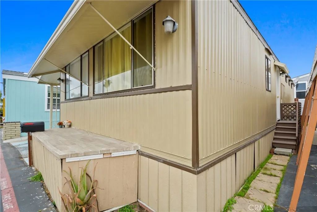 23701 South Western Avenue, Unit 197 Torrance, CA 90501 - Photo 28 of 32 a view of a house with wooden stairs