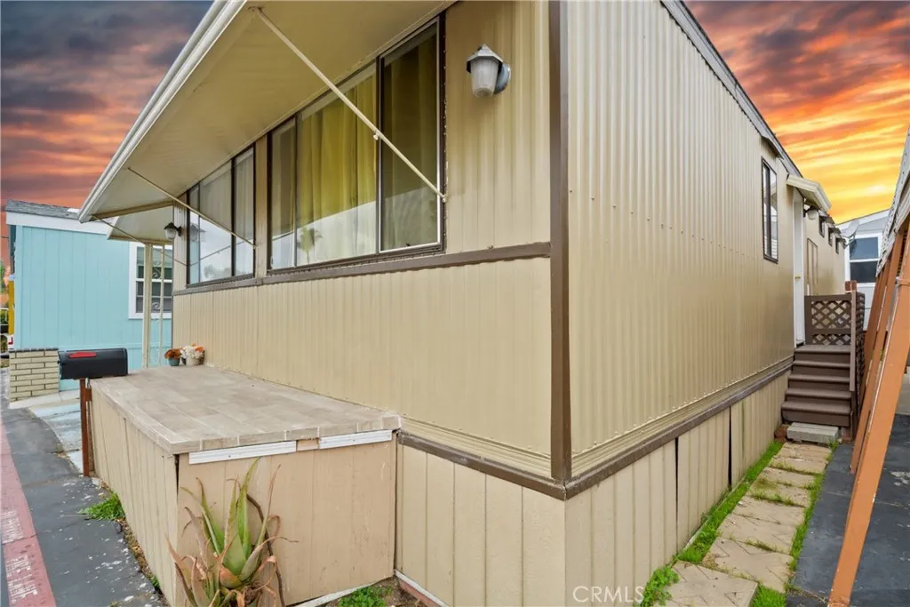 23701 South Western Avenue, Unit 197 Torrance, CA 90501 - Photo 31 of 32 a view of a house with wooden stairs