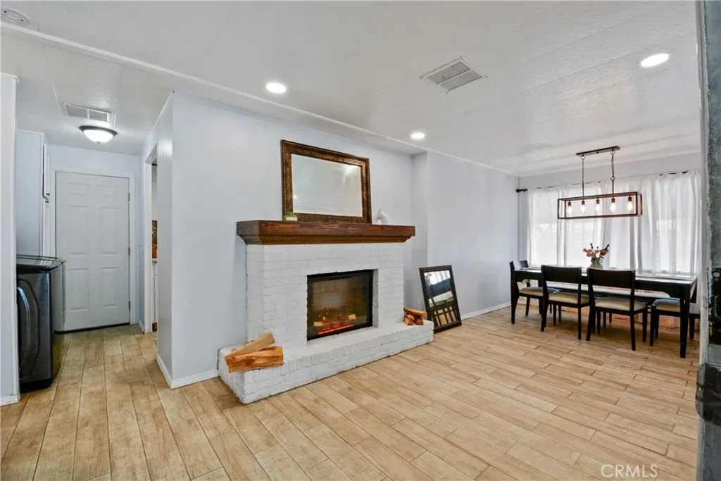 23701 South Western Avenue, Unit 197 Torrance, CA 90501 - Photo 7 of 32 a living room with furniture and a fireplace