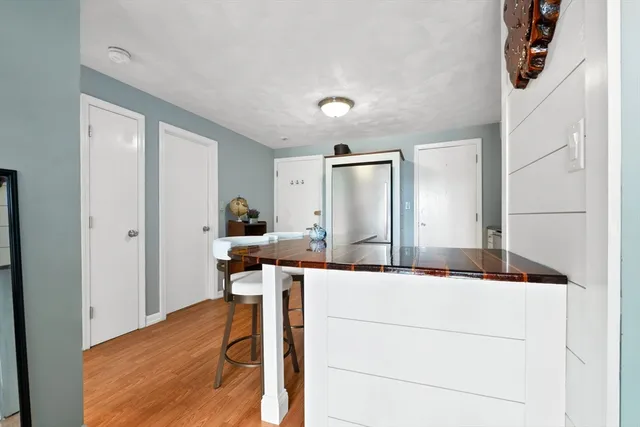 a kitchen with a sink and a refrigerator