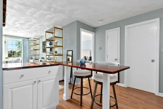 a kitchen with a table and chairs in it