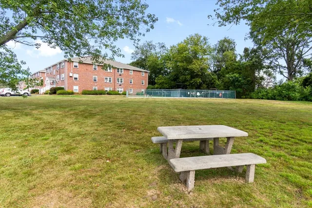 a view of a table and chairs in the garden