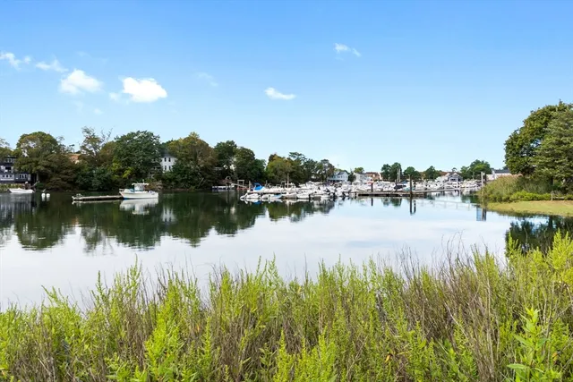a view of a swimming pool with an outdoor space and seating area